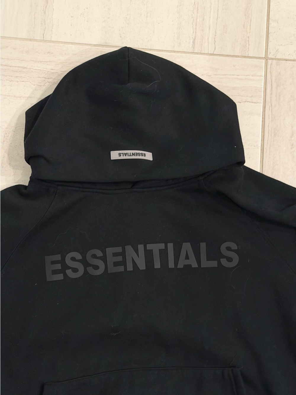Revolve-Essentials Hoodie in black with Tonal ESSENTIALS Logo